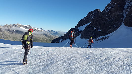 people hiking on snowy mountain during daytime thumbnail
