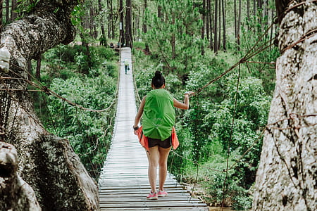 woman walking on bridge thumbnail