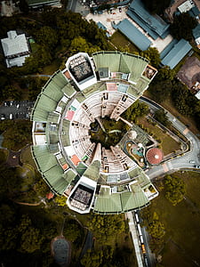 aerial photo of green and white high-rise building thumbnail