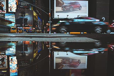 time lapse photography of black car in city thumbnail