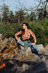 woman sitting on log posing for photo shoot thumbnail