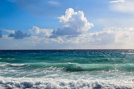 blue and teal ocean during daytime thumbnail