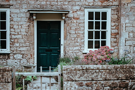 closed gate in front green wooden door thumbnail