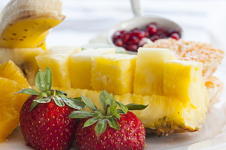 pineapple slices and strawberries served on plate thumbnail