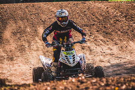 man riding ATV number 268 during daytime thumbnail