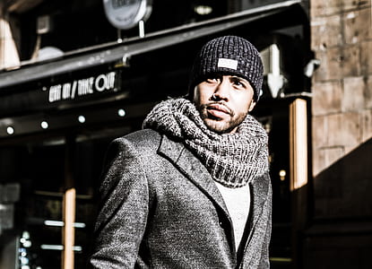 man wearing black knit scarf and cap thumbnail