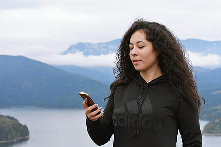 Woman in Black Adidas Pullover Hoodie thumbnail