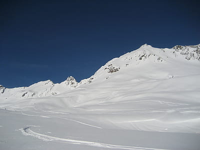 mountain covered with snowfield at daytime thumbnail