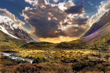 high angle view of trees surrounded with mountains thumbnail