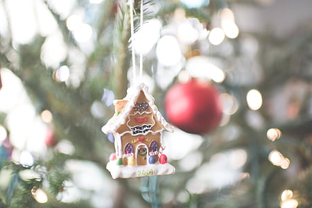 bokeh photograph of gingerbread house ornament thumbnail