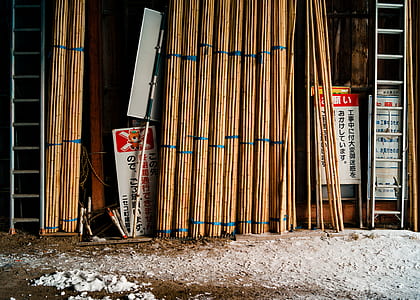 brown wooden stick leaning on wall thumbnail