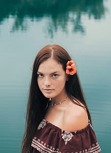 woman near body of water thumbnail