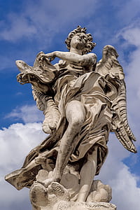 low angle photo of St. Michael statue thumbnail