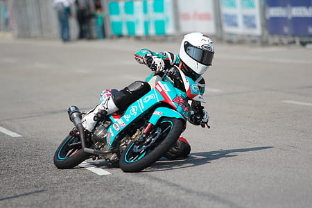 man riding blue motorcycle thumbnail