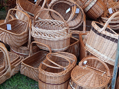 stacks of brown wicker baskets on green grass thumbnail