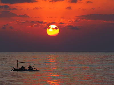 silhouette photo of two man riding a boat fishing on calm body of water during golden hour thumbnail
