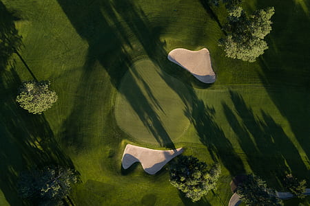 aerial photography of two white boulder on grass field thumbnail