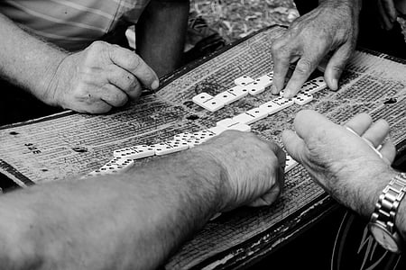 grayscale photography of person touching cube thumbnail