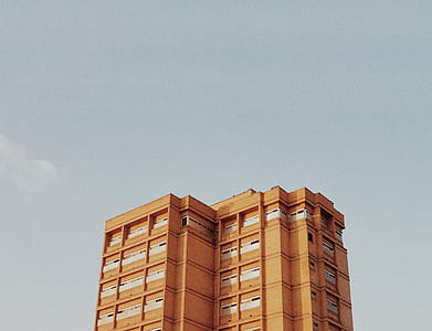 brown concrete high-rise building at daytime thumbnail