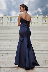 woman wearing strapless dress standing on stairs thumbnail