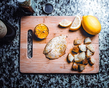 fried dish with lemon on chopping board thumbnail