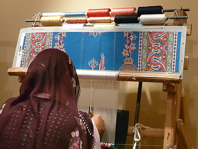 person wearing brown floral scarf thumbnail