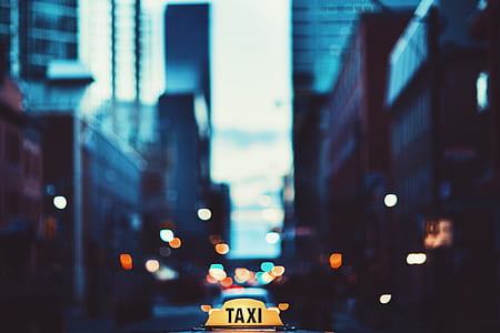 focus photography of taxi emblem thumbnail