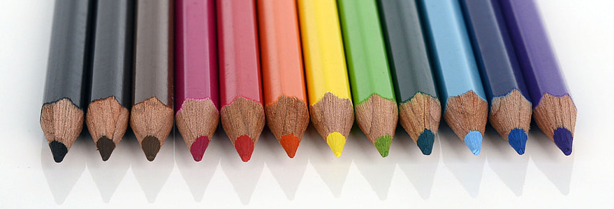 assorted-color pencil lot on white surface thumbnail