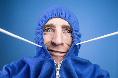 man wearing blue zip-up hoodie thumbnail