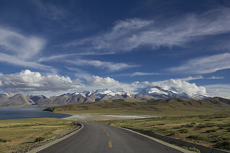 landscape photo of green valley near in ocean thumbnail