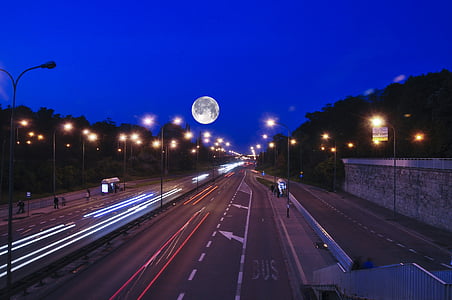 vehicles on road during nighttime thumbnail