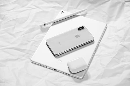 silver iPad, iPhone X and Pencil on white cloth thumbnail