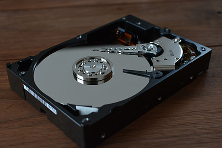 black optical drive on brown wooden surface thumbnail