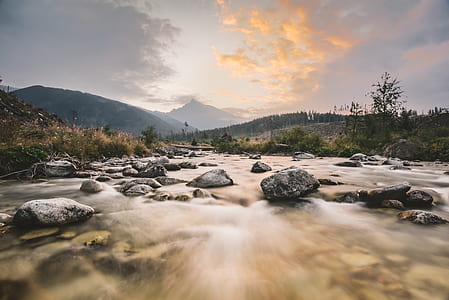 time-lapse photography of river with rocks thumbnail