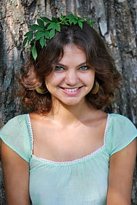 woman wearing green leaf headdress thumbnail