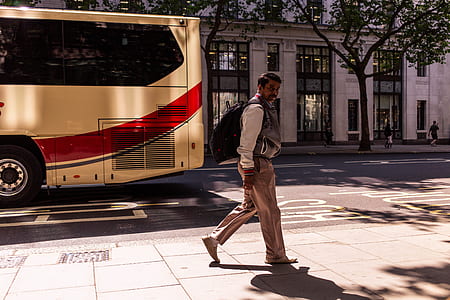 man standing near bus thumbnail