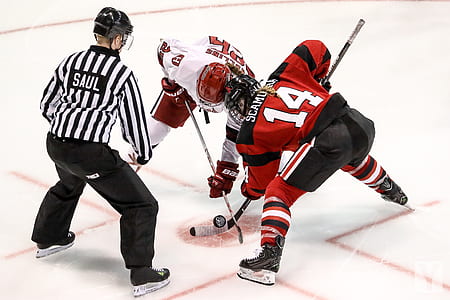 referee standing on brawling NHL player thumbnail