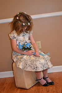 girl sitting on chair inside the house thumbnail