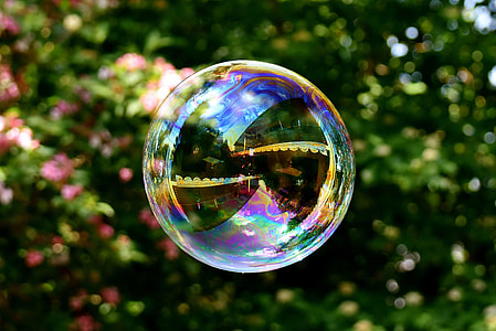 round soap bubble floating in the air during day time thumbnail