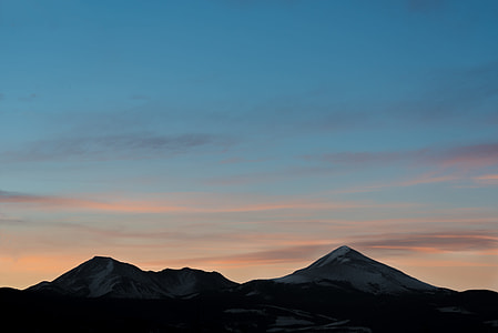 silhouette of mountain ranges during golden hour thumbnail