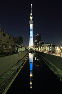 grey lighted tower under sky at nighttime thumbnail