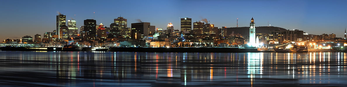 assorted buildings on body of water during sunset thumbnail