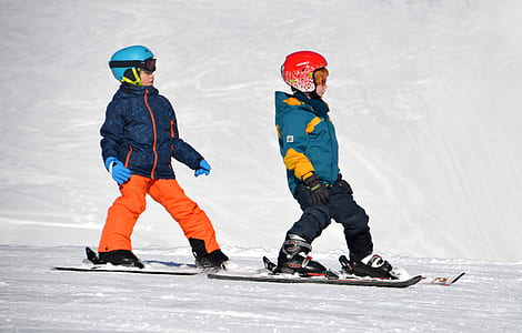 photography of children riding snowboards thumbnail