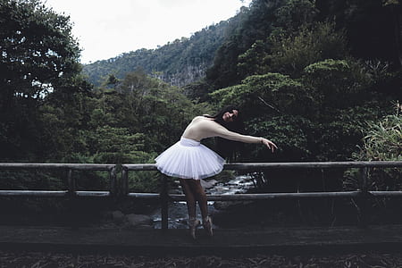 woman standing near bridge thumbnail