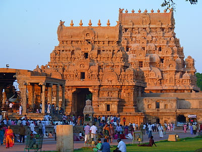 people gathering beside brown temple thumbnail