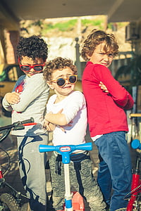 three boy standing in front of their bicycles and scooters thumbnail