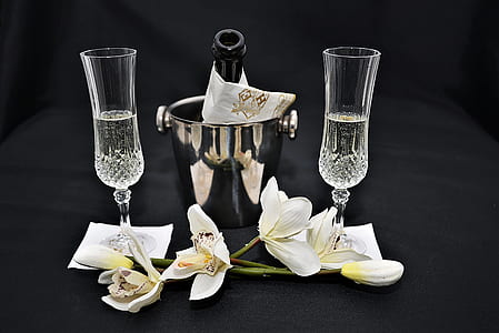 white flowers and clear wine glasses thumbnail