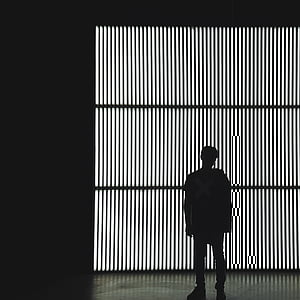 man standing in front of window thumbnail