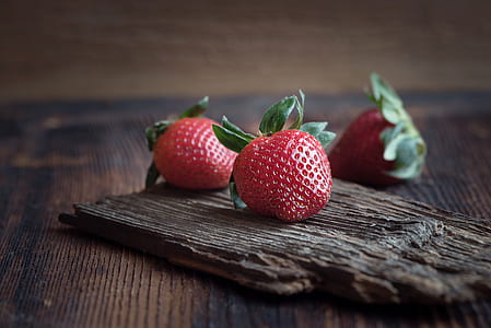 close up photo of three red strawberries thumbnail