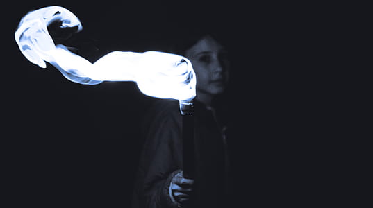 woman holding black stick thumbnail